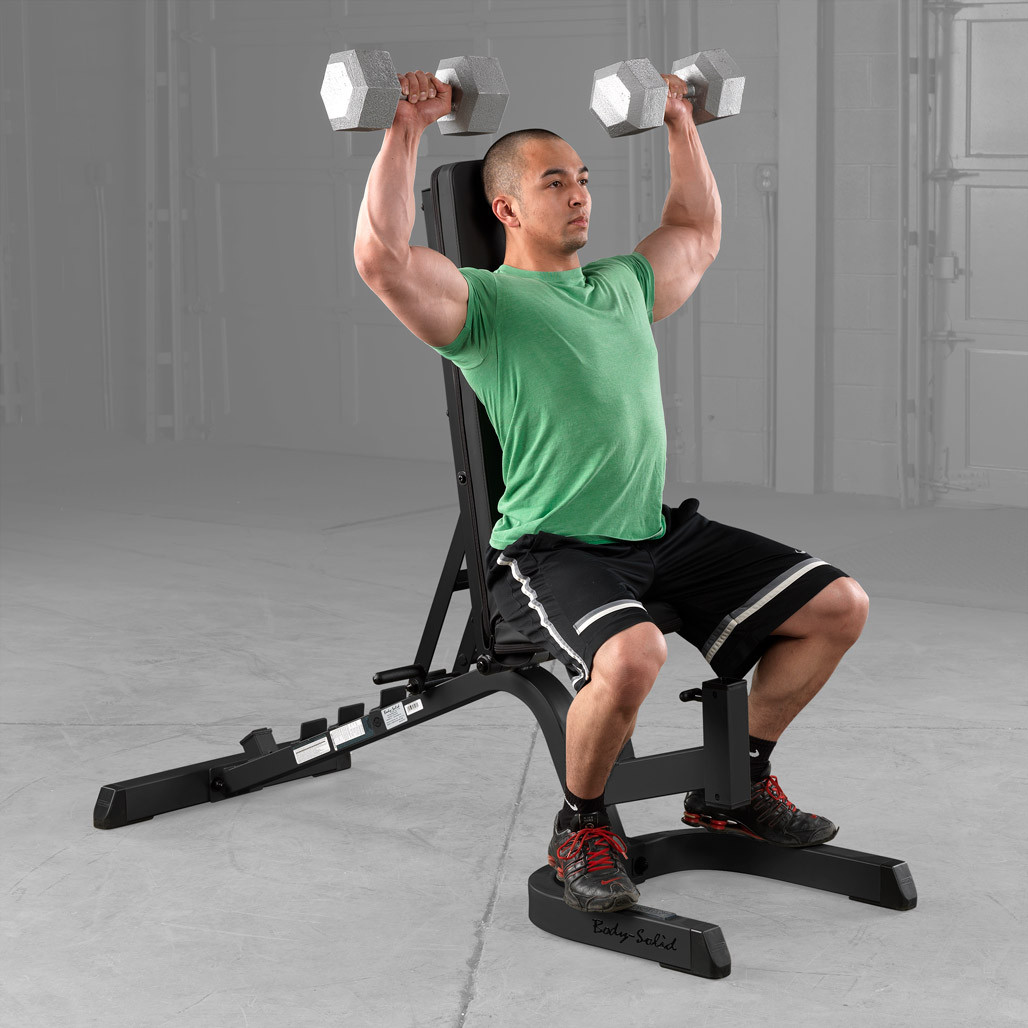 Athlete training on the Body-Solid GFID71B heavy duty bench