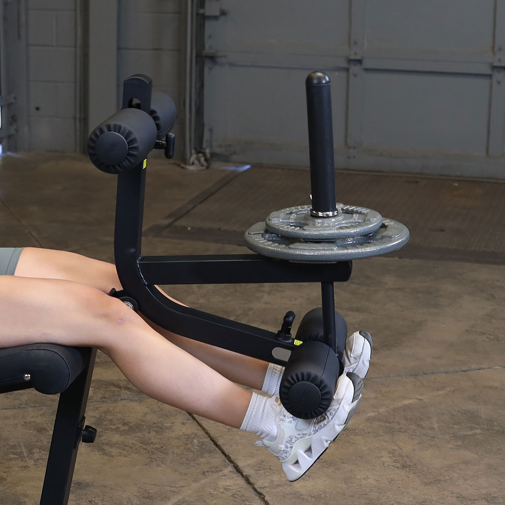 Body-Solid GLCE365B Leg Extension & Prone Leg Curl Machine in black finish, shown from the side.
