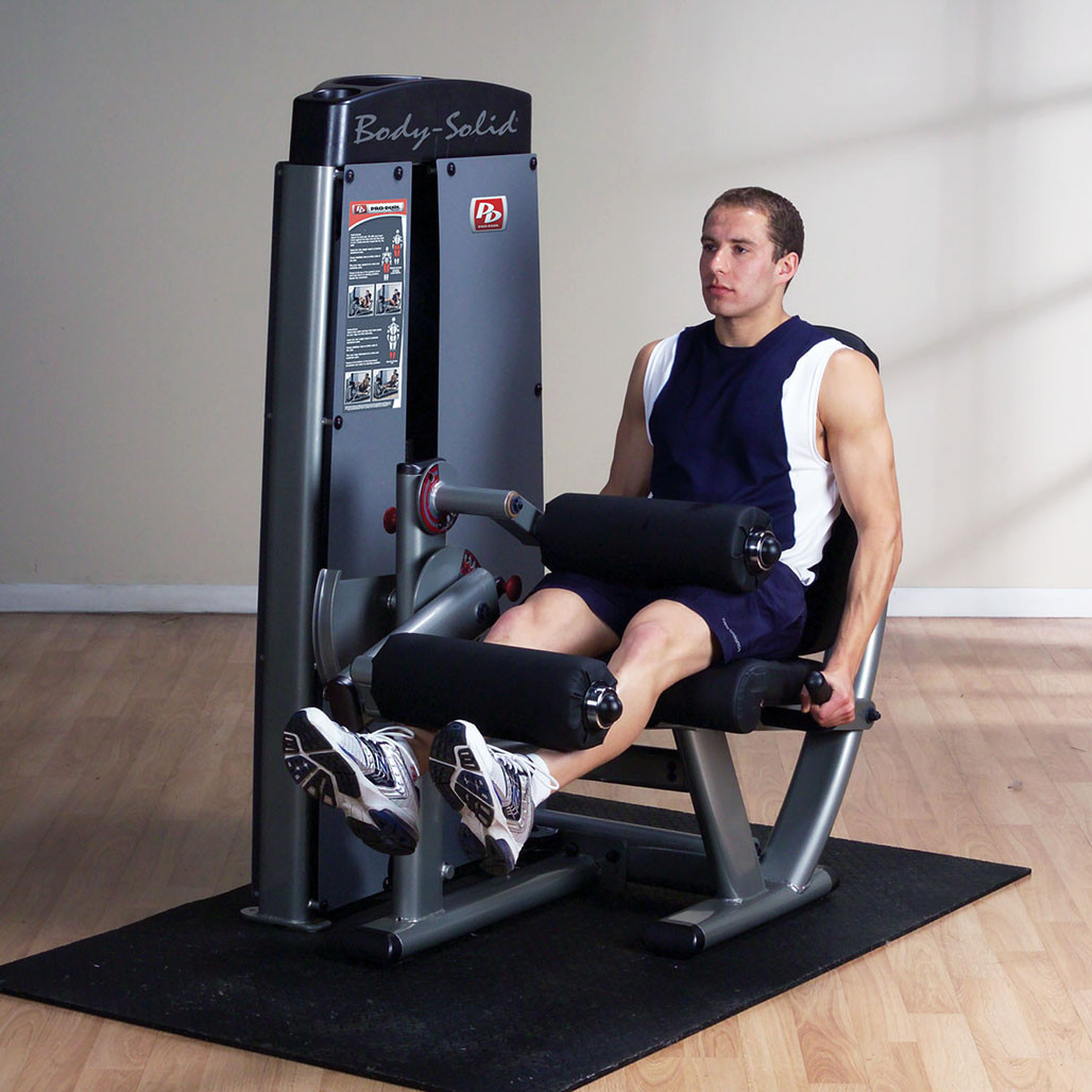 Athlete performing a leg curl on the Body-Solid Pro Clubline DLECSF
