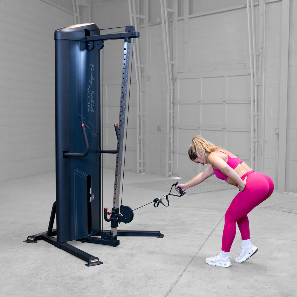 User performing a triceps pushdown on the Body-Solid S2CC