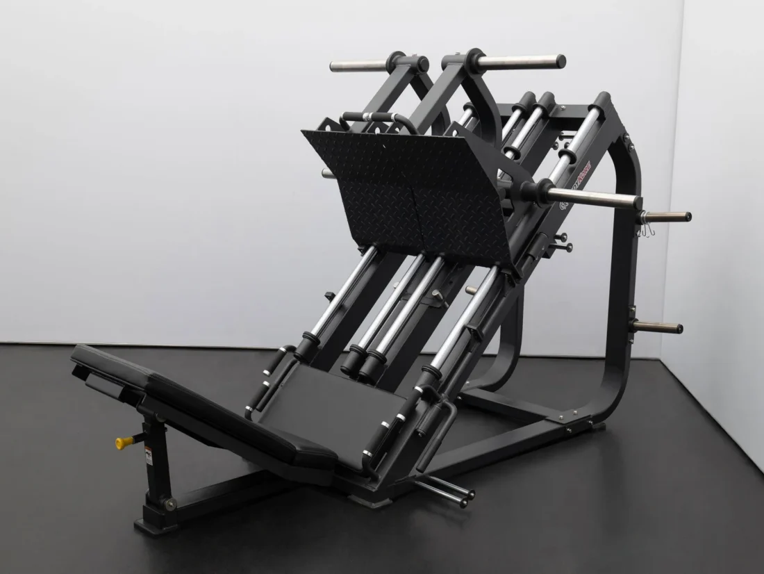 Side detail of the BodyKore FL1801 isolateral leg press showing the heavy-duty steel frame, weight horns and seat assembly