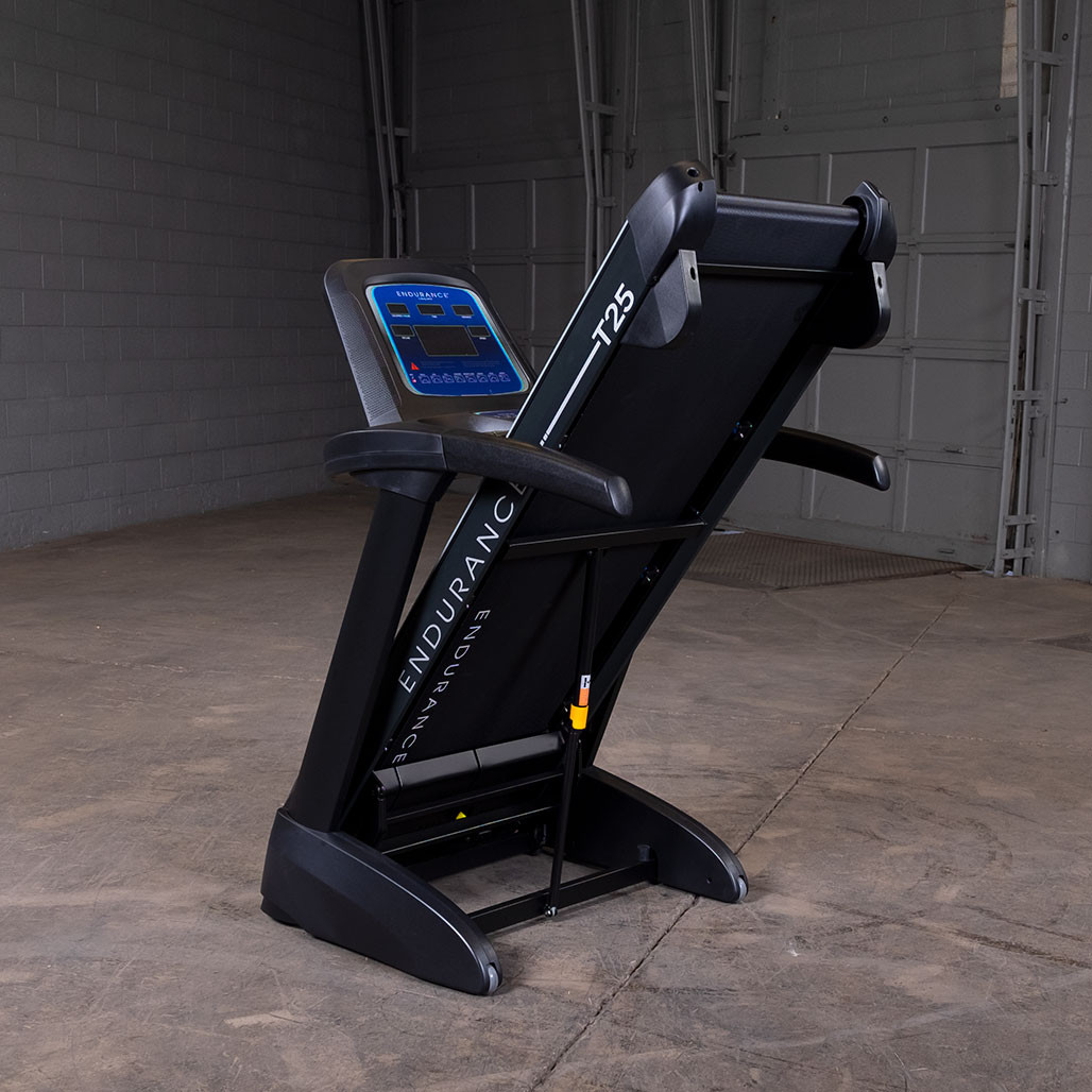 Endurance T25 folding treadmill shown folded upright for compact storage