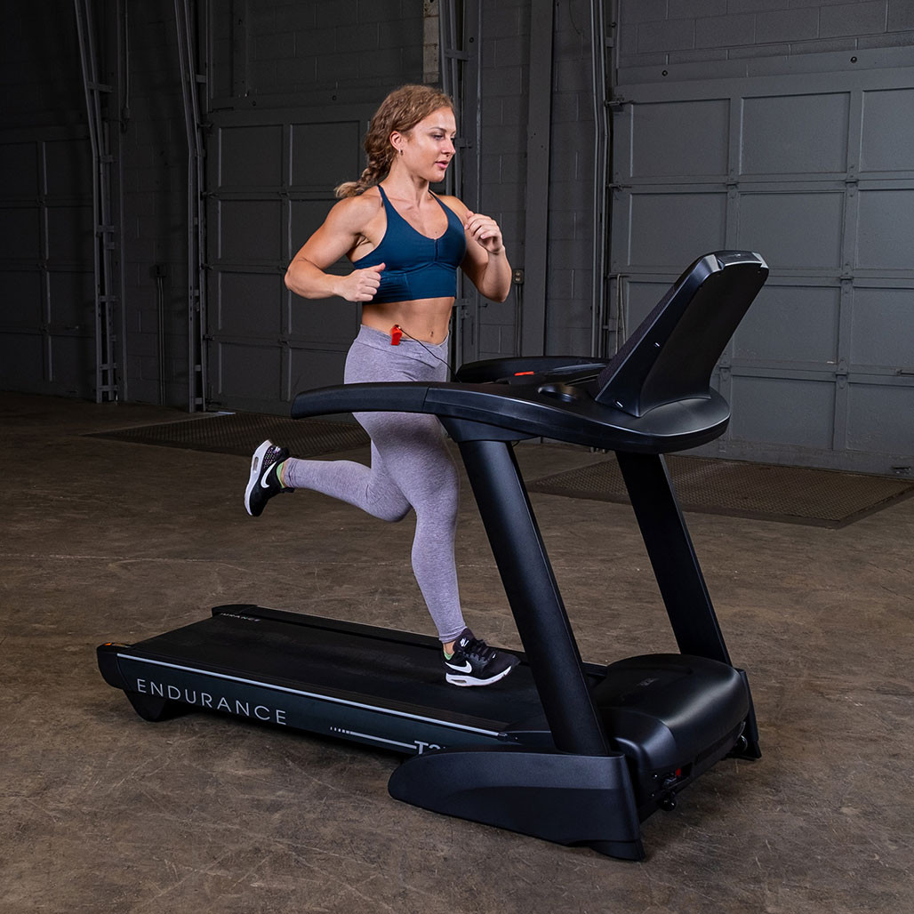 Athlete running on the Endurance T25 folding treadmill with incline