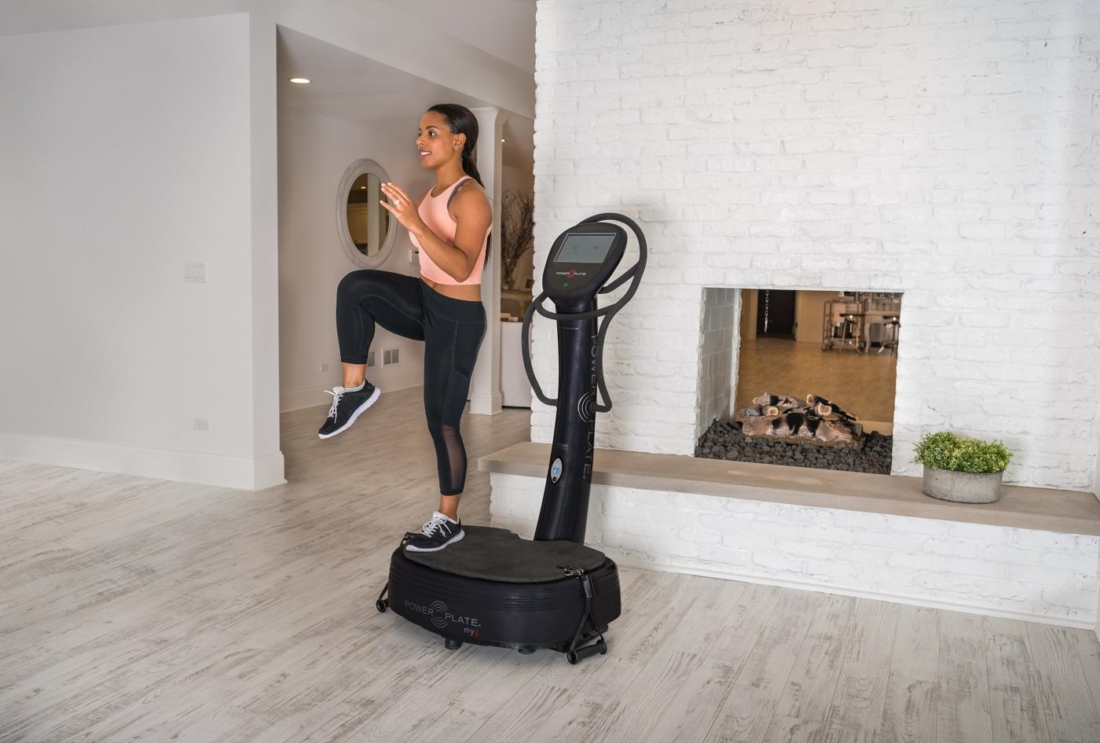Woman performing lunge on Power Plate my8 vibration platform