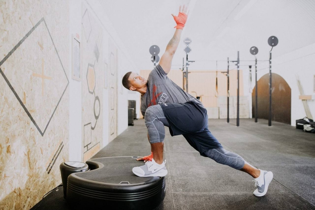 Athlete stretching with Power Plate pro5HP vibration platform