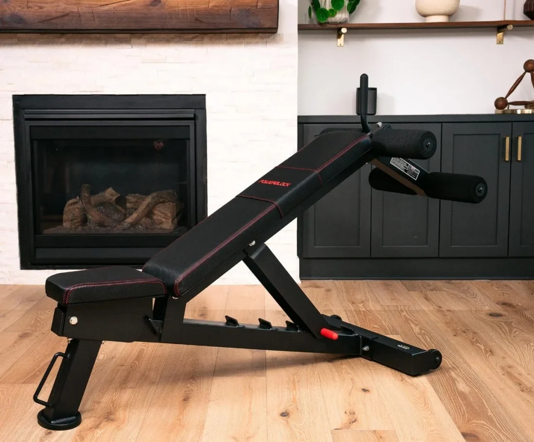 PowerBench 2.0 ab attachment set up in a home gym
