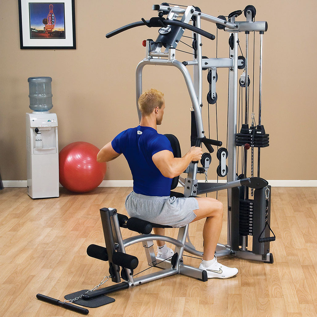 Athlete training on the Powerline P2X home gym cable station