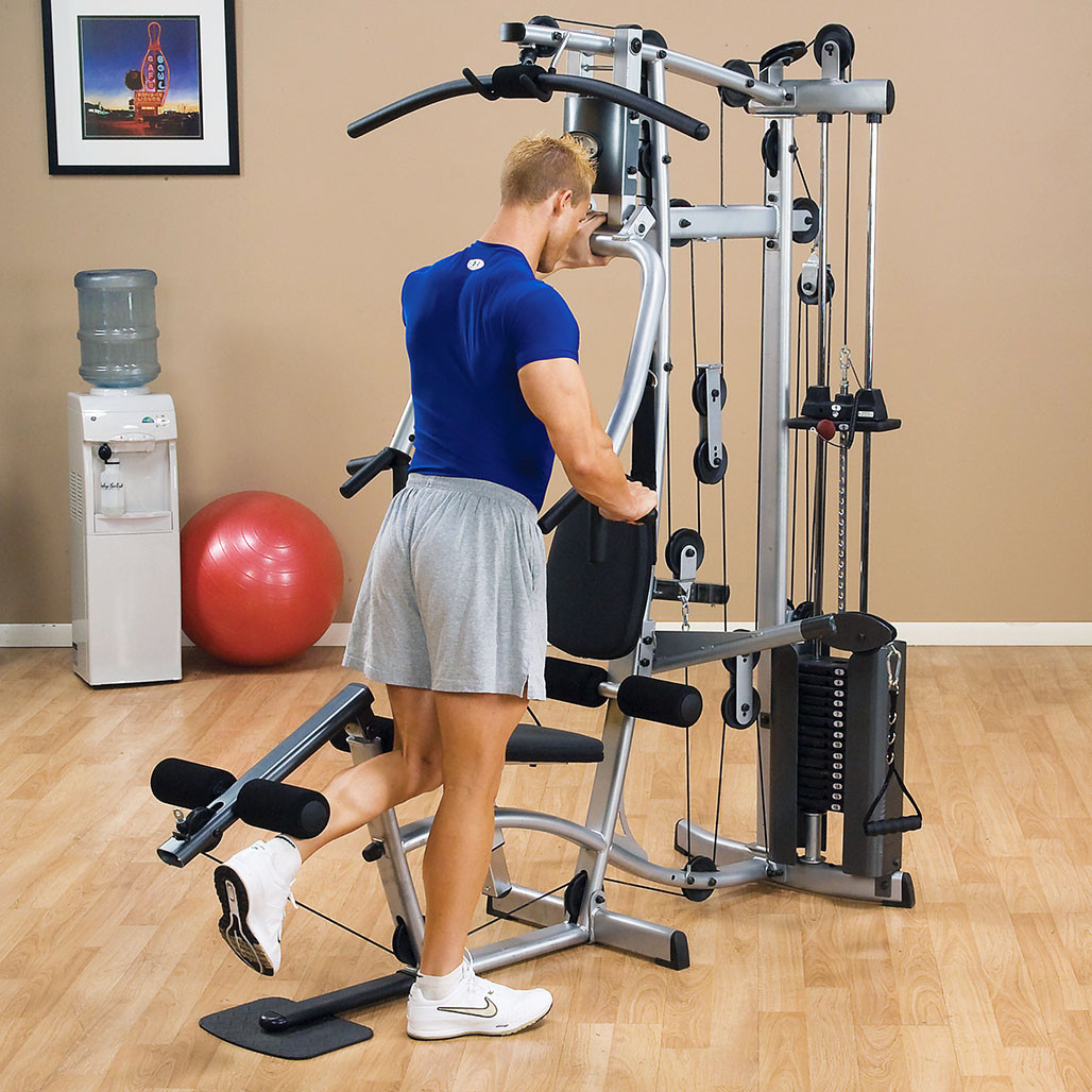 Athlete performing chest press on the Powerline P2X home gym
