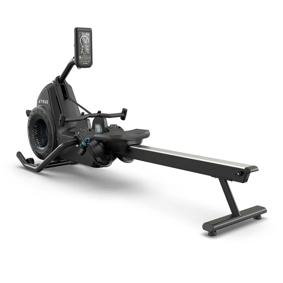 TRUE Ro rower left rear three-quarter view showing the seat rail and fan housing