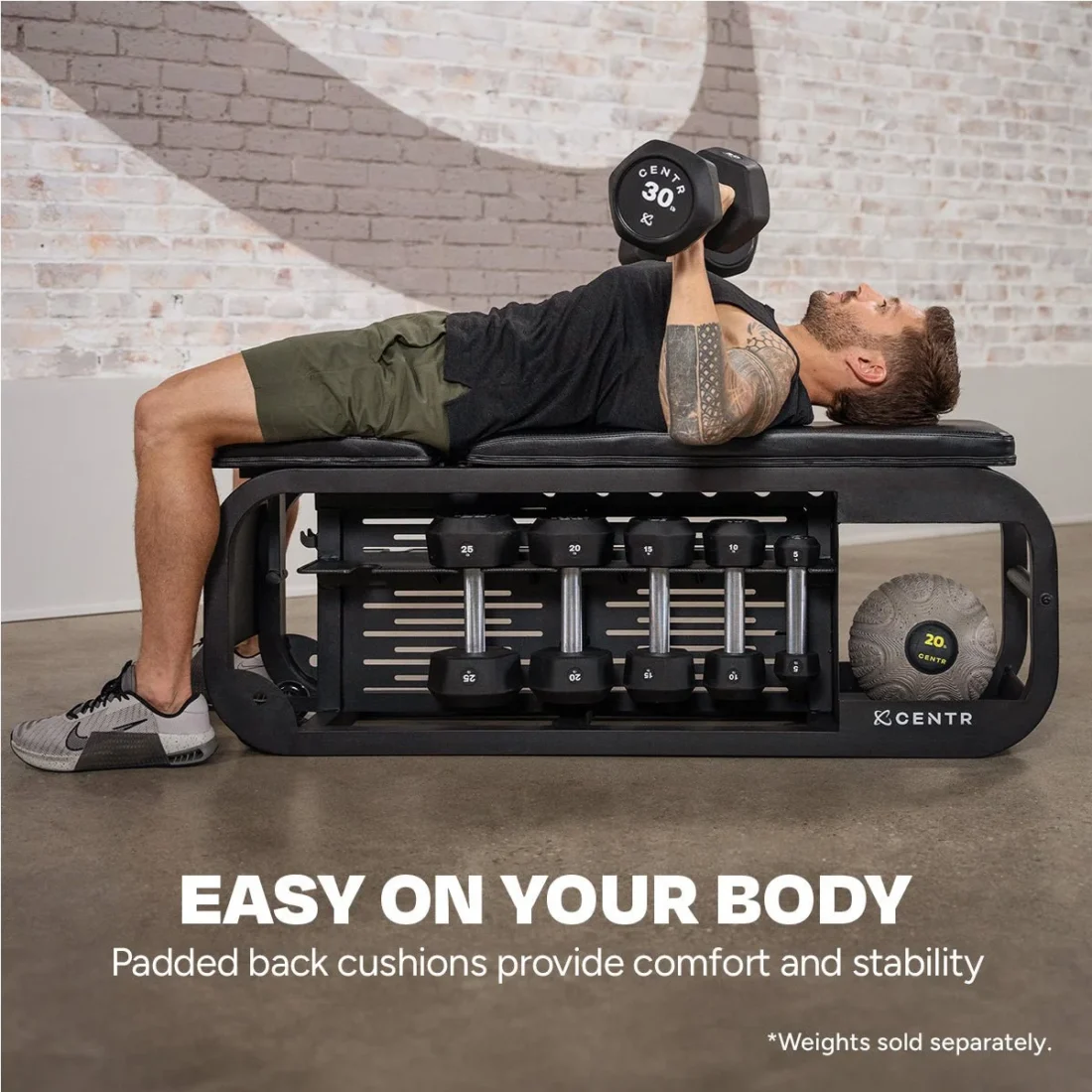 Man doing a flat dumbbell chest press on the Centr Fusion Bench