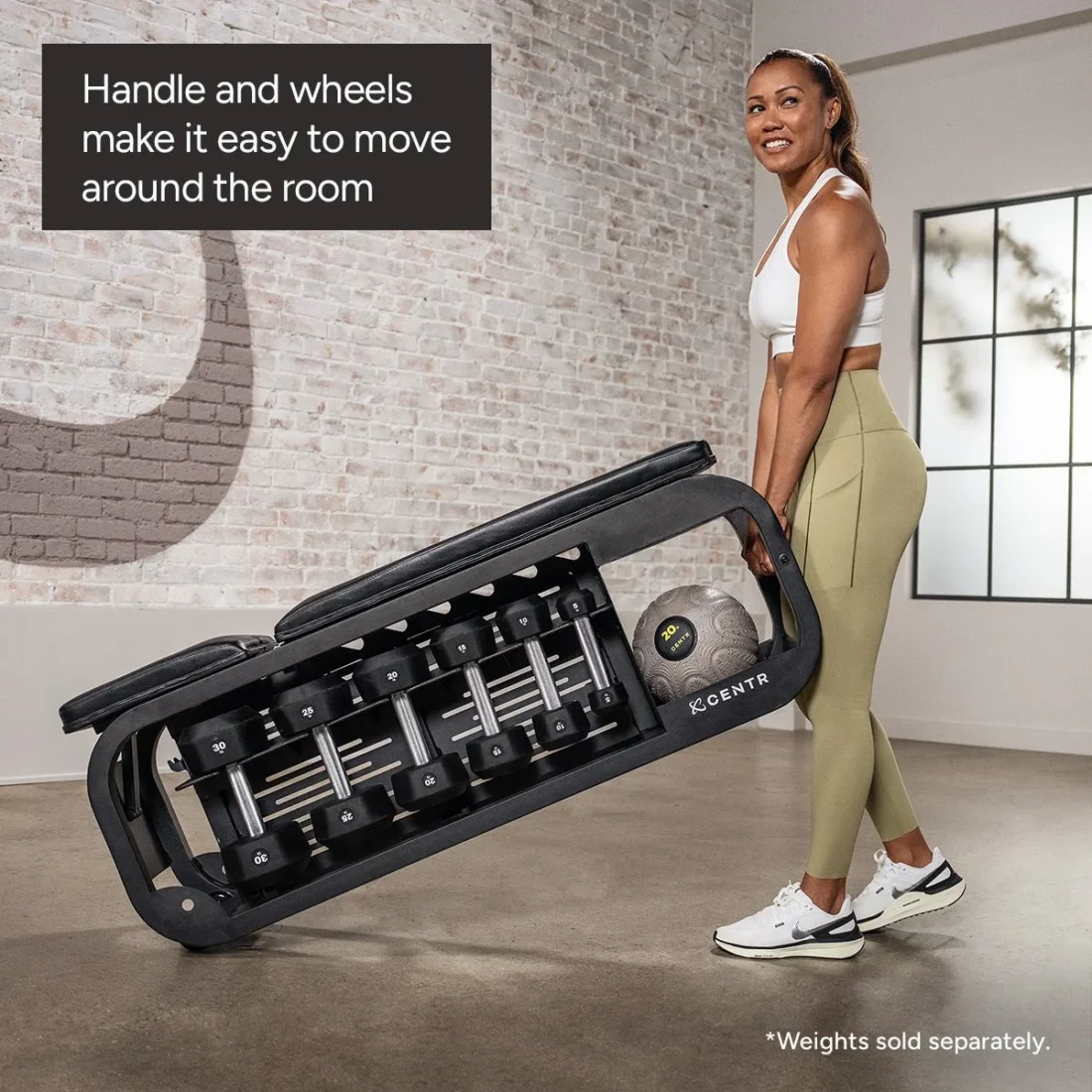 Woman rolling the Centr Fusion Bench by its handle