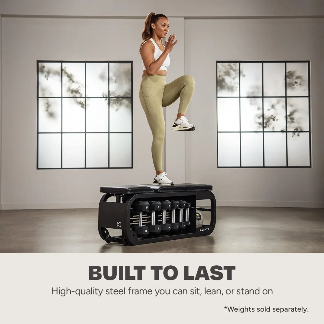 Woman doing step-ups on the Centr Fusion Bench