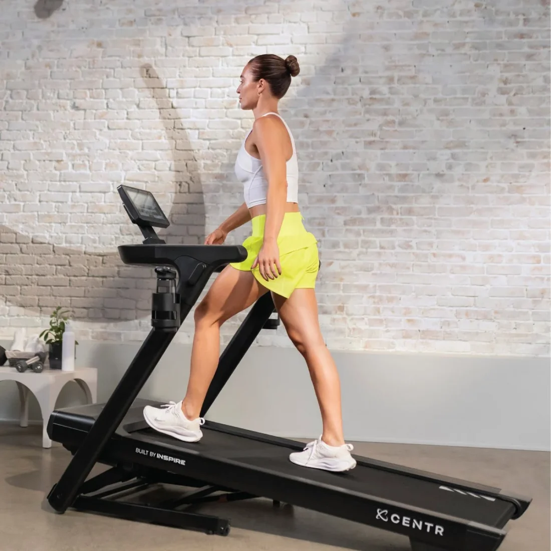 Woman walking on the Centr Runr-S treadmill at home