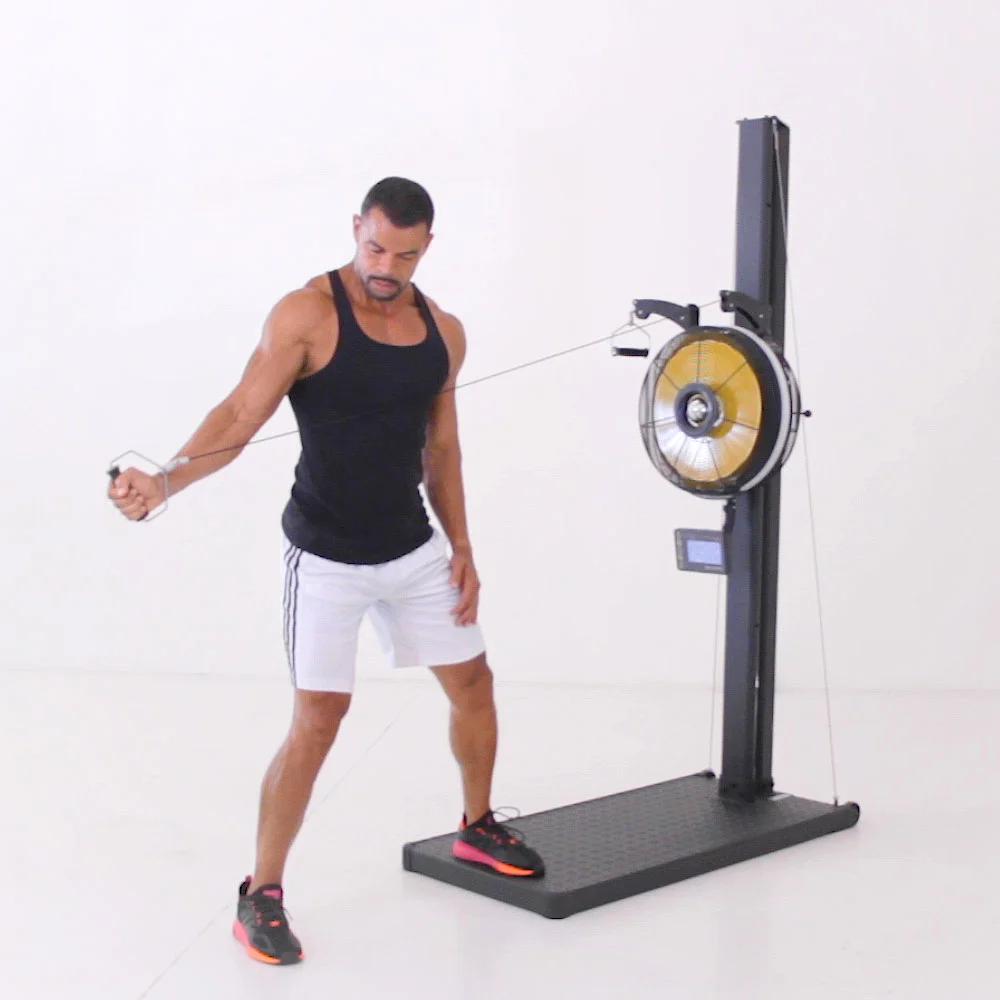 Athlete performing a rotational cable pull on the Renegade Raptor Functional Trainer with the fan rotated to the horizontal position