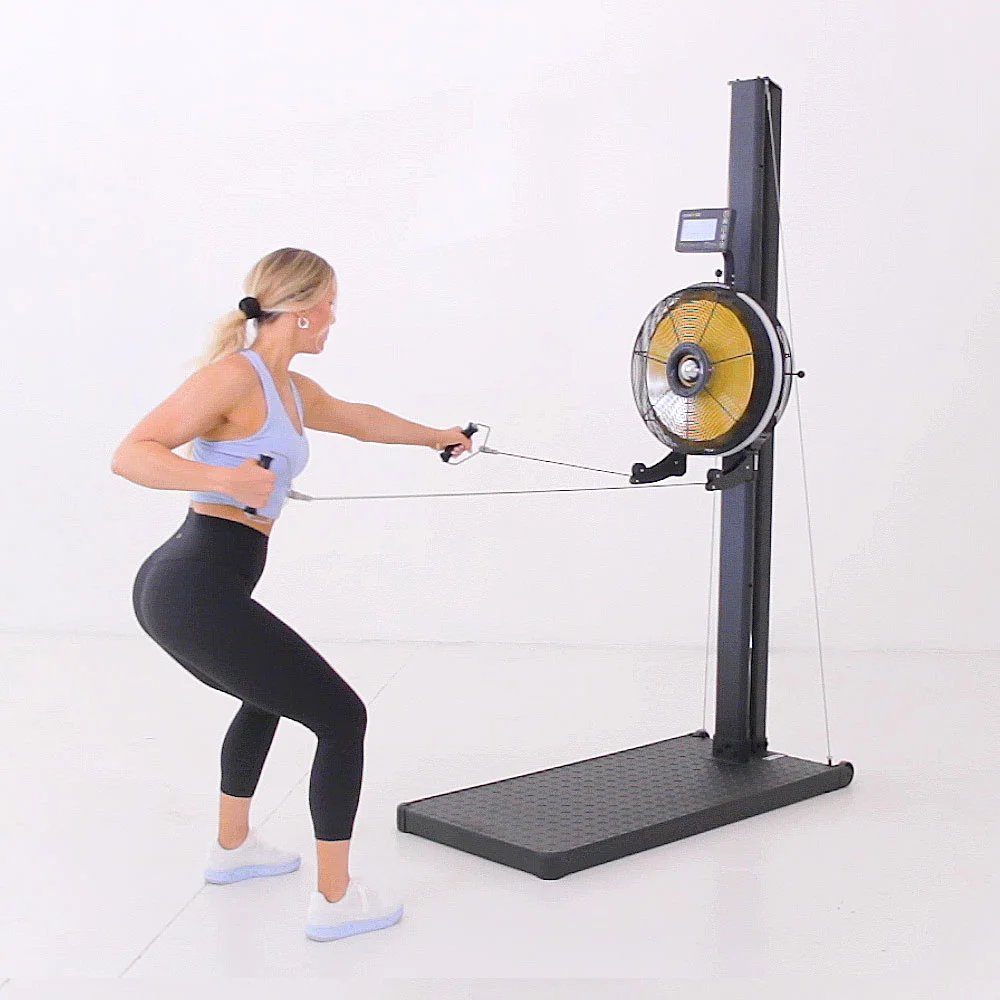 Athlete performing a squat-to-row movement on the Renegade Raptor Functional Trainer from the mid pulley position