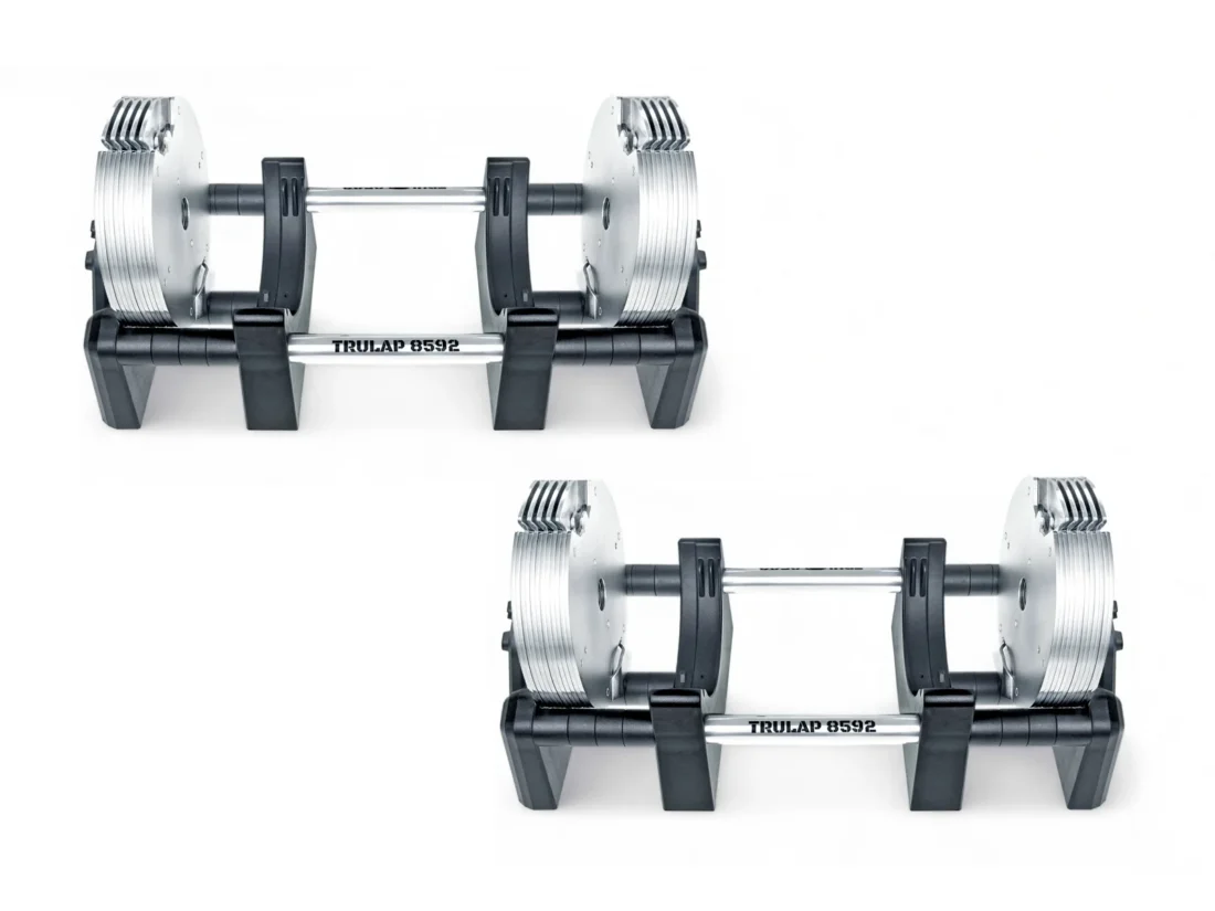 Two Trulap dumbbells upgraded with the expansion kit, staggered side view on their docking bases
