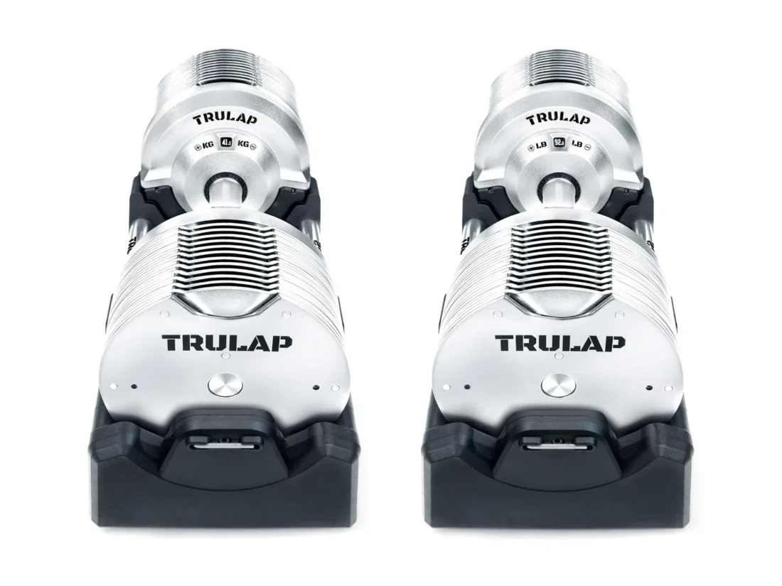 Trulap 8592 G4 adjustable dumbbell pair in their docking bases, front view with the Trulap logo plates