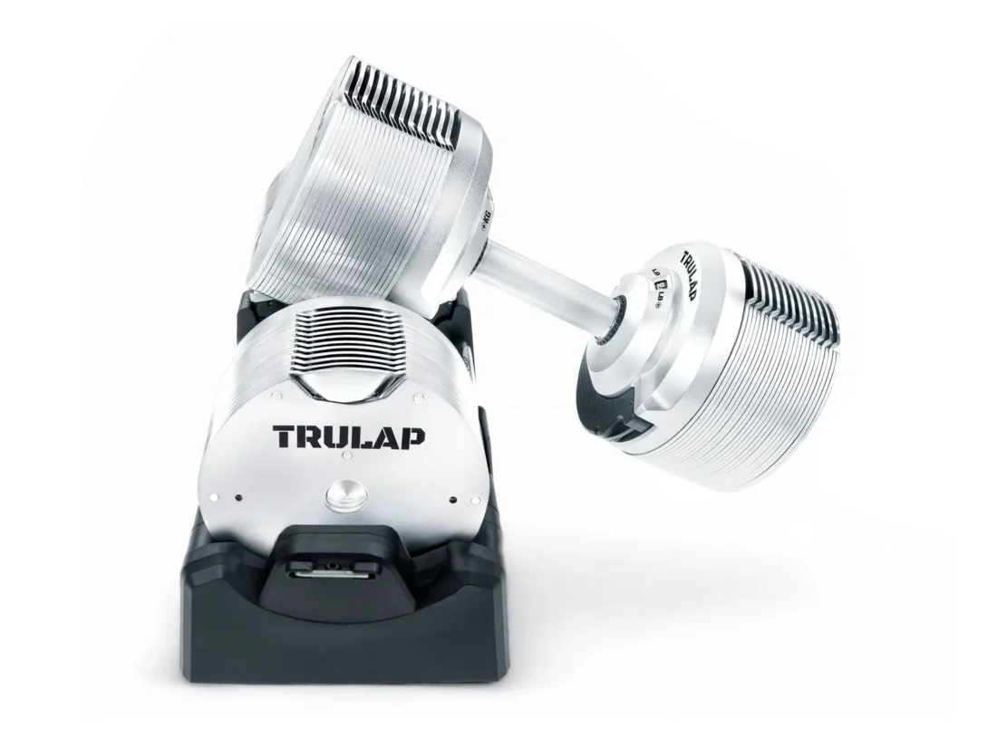 One Trulap 8592 G4 dumbbell being lifted from its docking base with selected plates locked to the handle